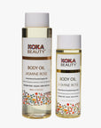 Two bottles of Koka Beauty Jasmine Rose body oil on a white background