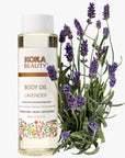 Koka Beauty lavender body oil bottle with lavender flowers on a white background