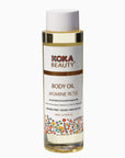 Koka Beauty Jasmine Rose body oil bottle on a white background