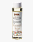 Koka Beauty product bottle with label on a white background