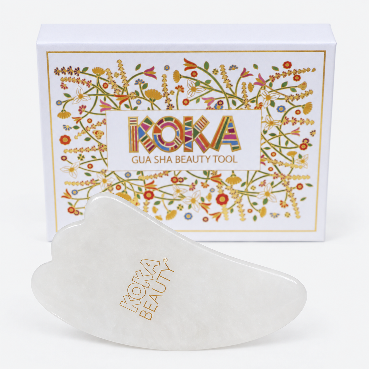 Koka Beauty white jade gua sha tool with three-point scalloped edge